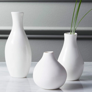 three porcelain bud vases of varying height